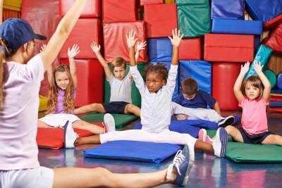 Children in gym stretching
