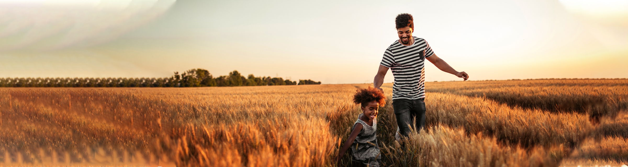 Father and daughter in field