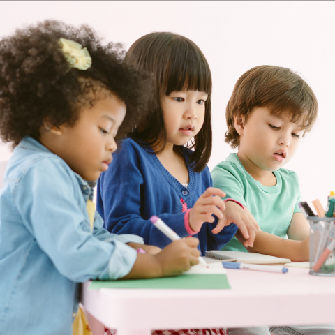 Group of toddlers coloring