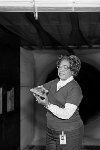 Mary Jackson in a wind tunnel with a model at NASA Langley