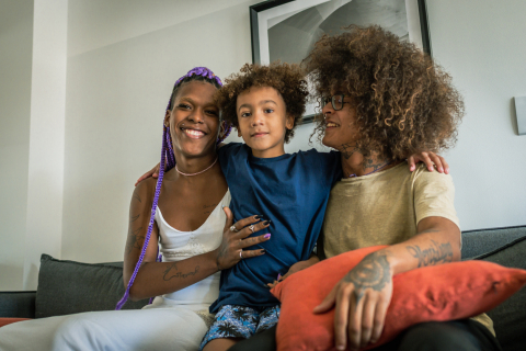 Black trans parents with child