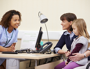 child and mother at pediatrician