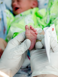 Baby Getting Blood Spot Card Taken