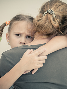 Girl Hugging Mother